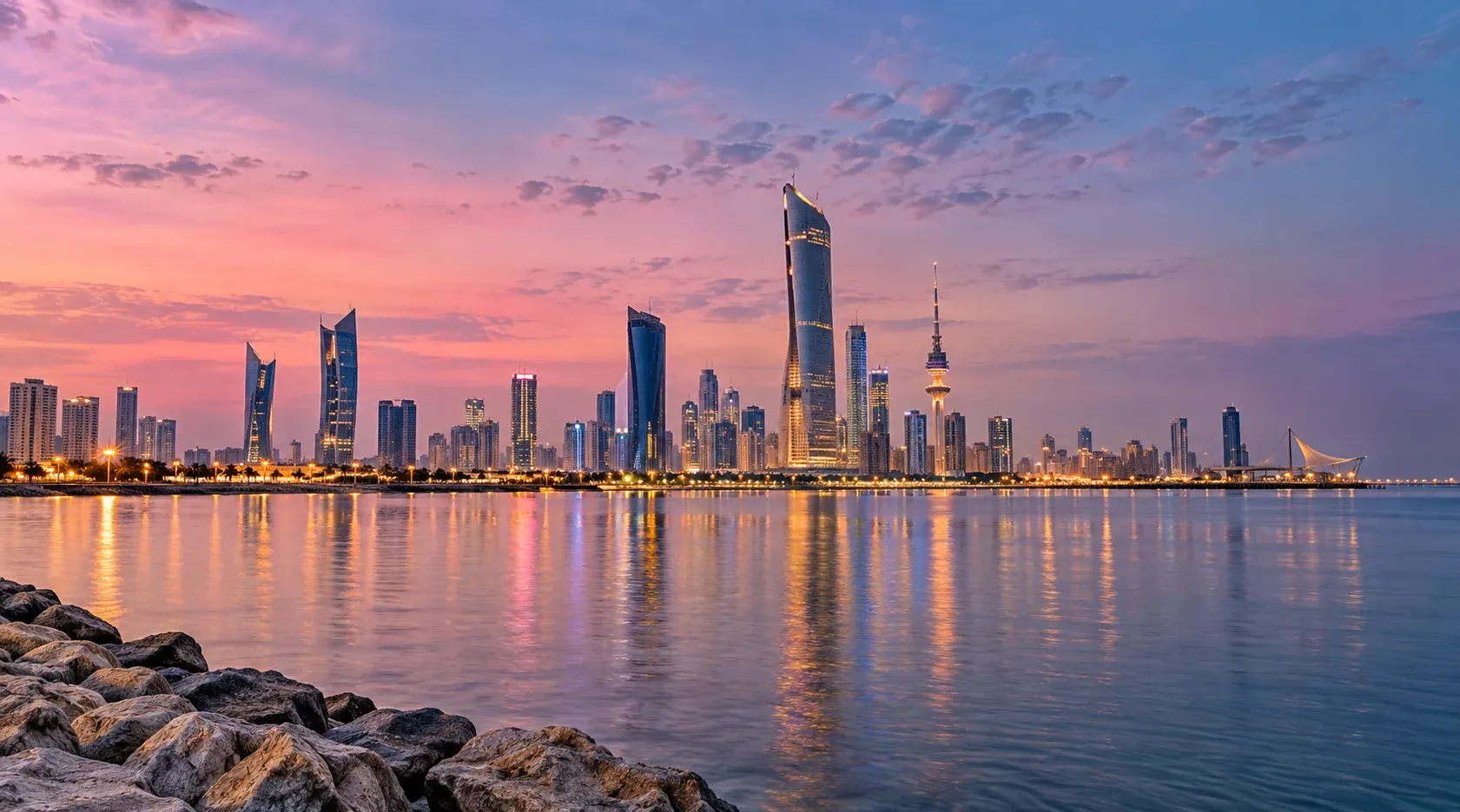 Kuwait City skyline beside the waterfront at dusk